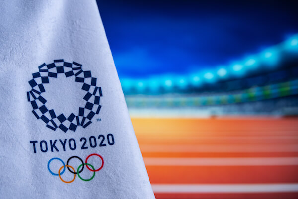 Tokyo Olympics Flag with logo - image by Krovop58/shutterstock.com Tokyo Olympics Flag with logo - image by Krovop58/shutterstock.com