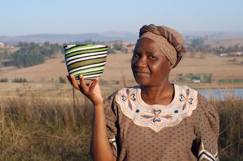Zulu woman showing a bowl